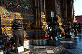 Bangkok Grand Palace,  Wat Phra Keow (temple of the Emerald Buddha). Bronze lion (singha)  statues in Khmer style guard the western entrance of the Ubosot.  